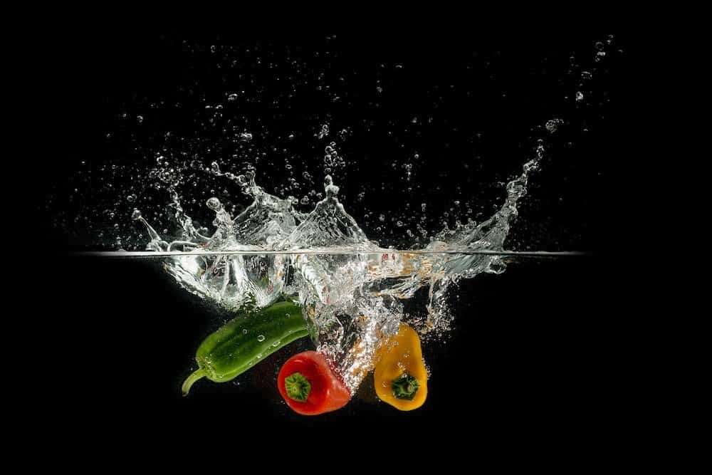 bell peppers falling in water