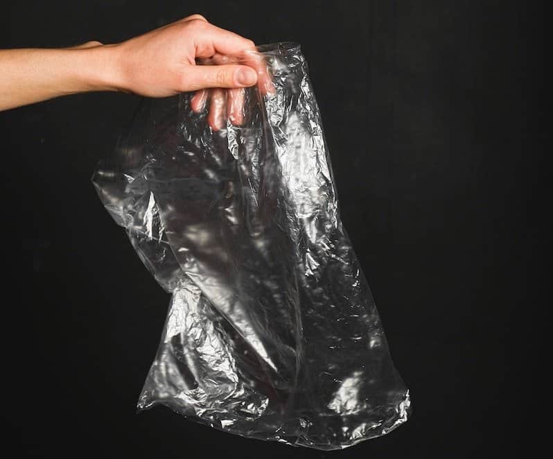 person holding plastic bag