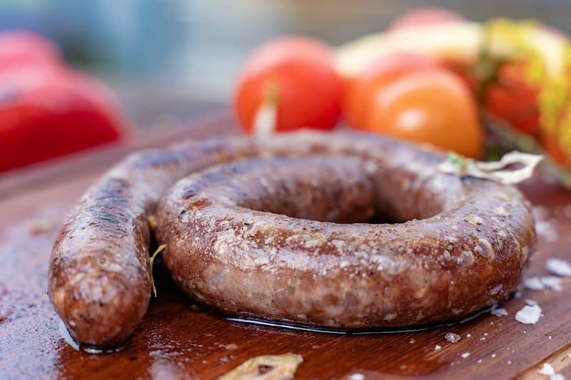 fresh sausage on chopping board