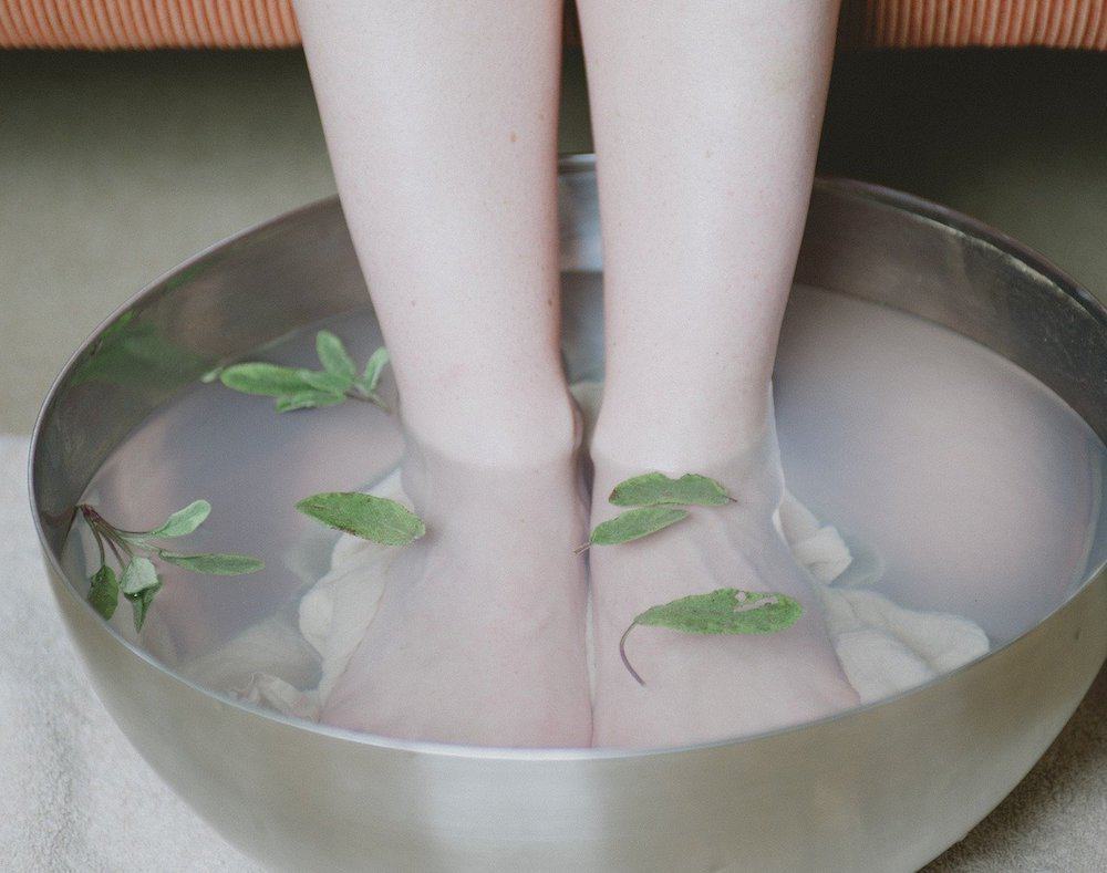 feet in foot bath in bowl