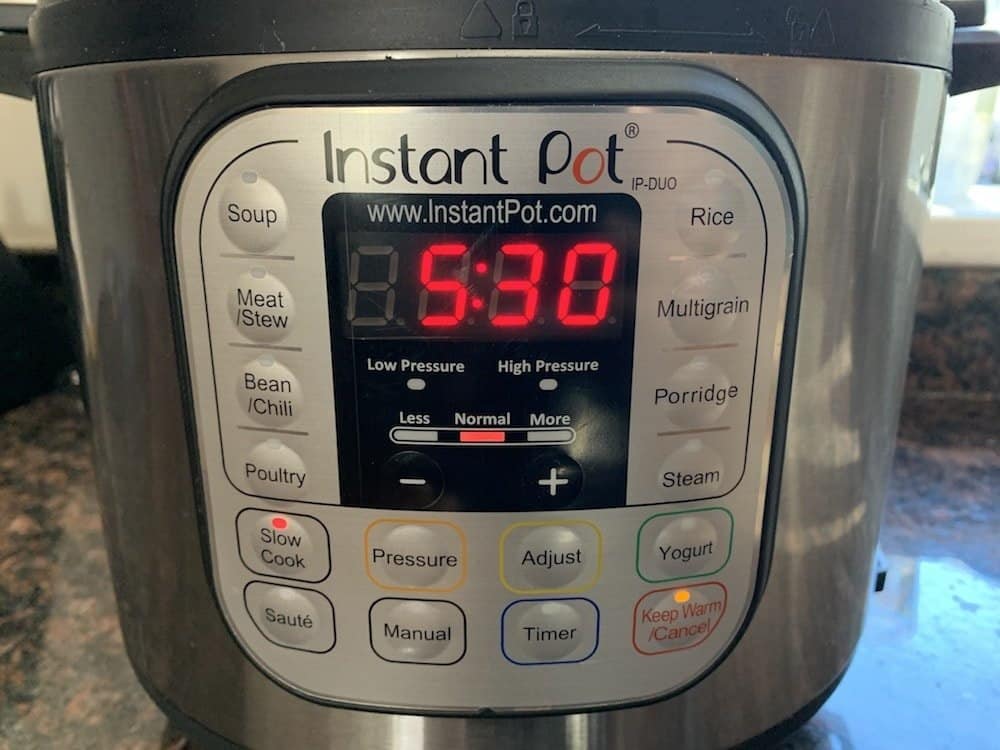 instant pot slow cooker display showing cooking time