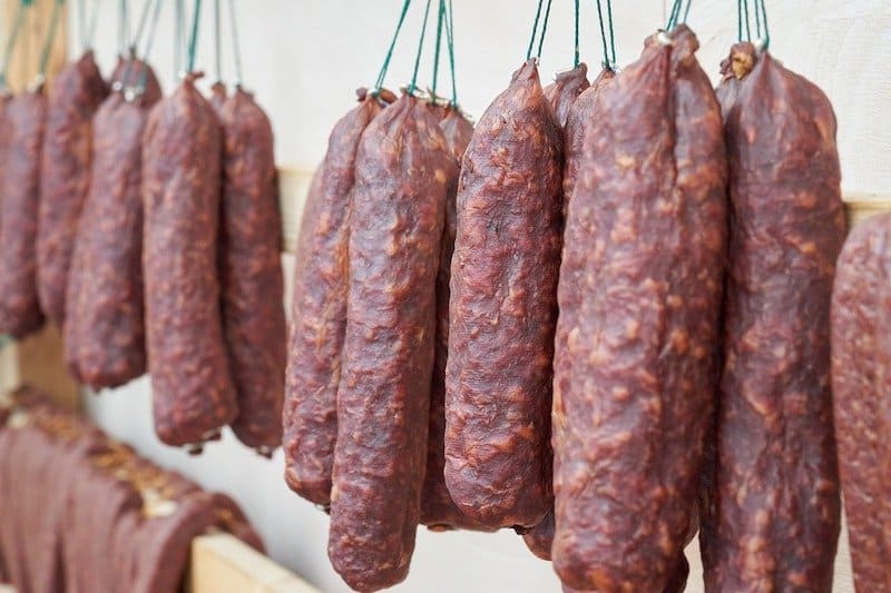 sausage in thick casing hanging