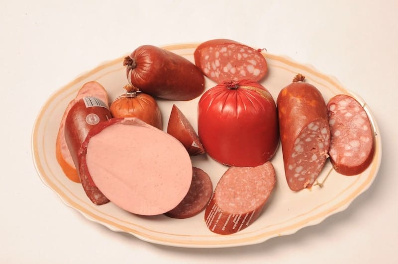 different types of summer sausage on a platter