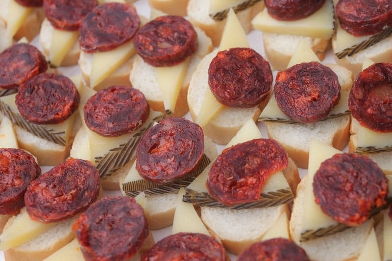 slices of chorizo on cheese and bread