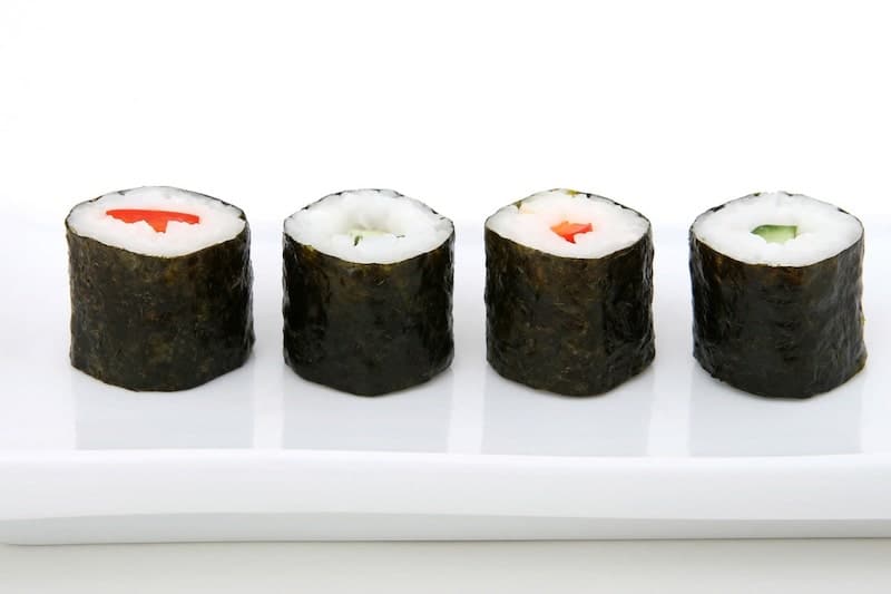 four rolls of maki in a line