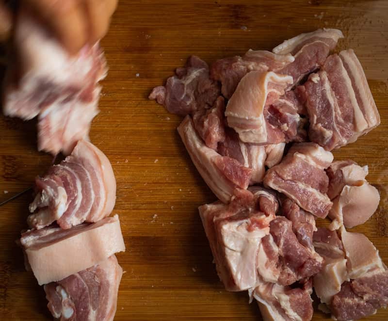 cutting board cuts of raw pork cheek