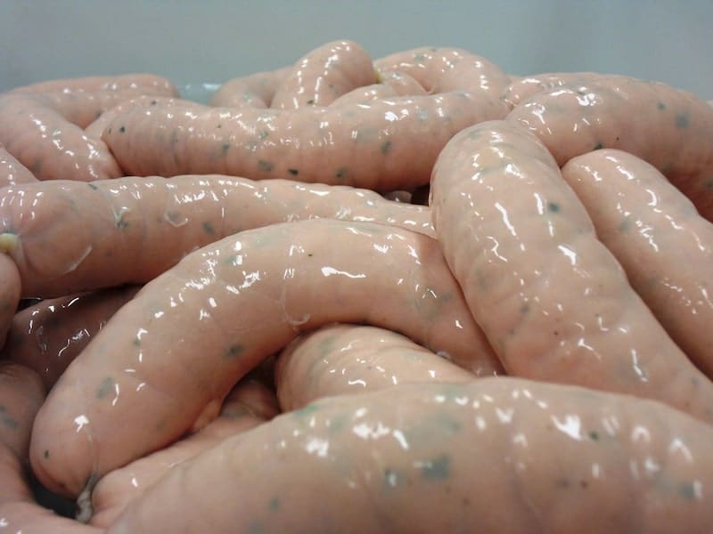  haufen von rosa Wurst mit glänzenden schleimigen Gehäuse Textur