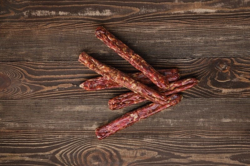 deer sausage on wooden background