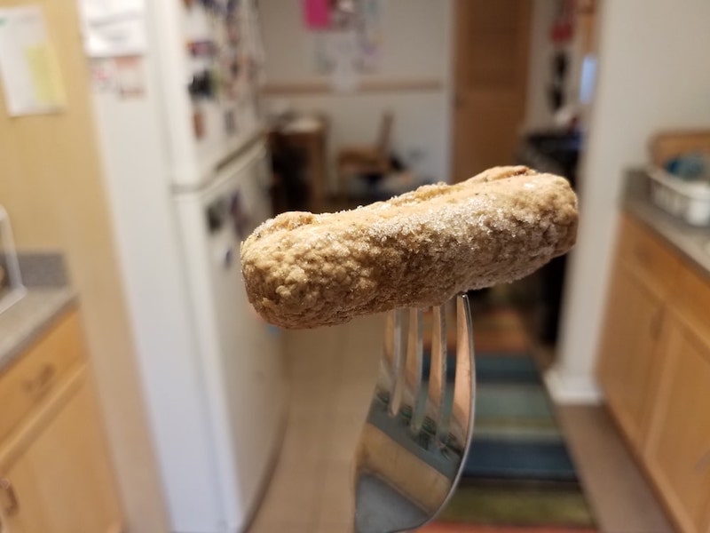 frozen sausage on fork