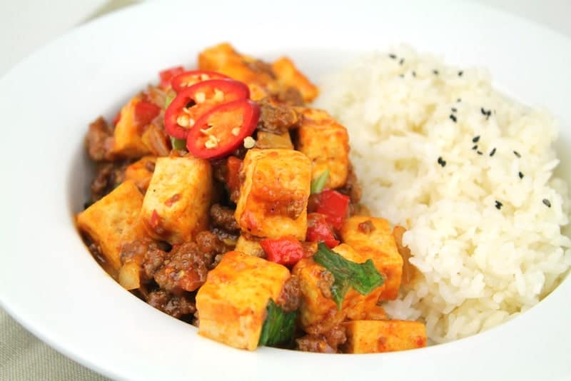 tofu stir fry in with white rice in bowl